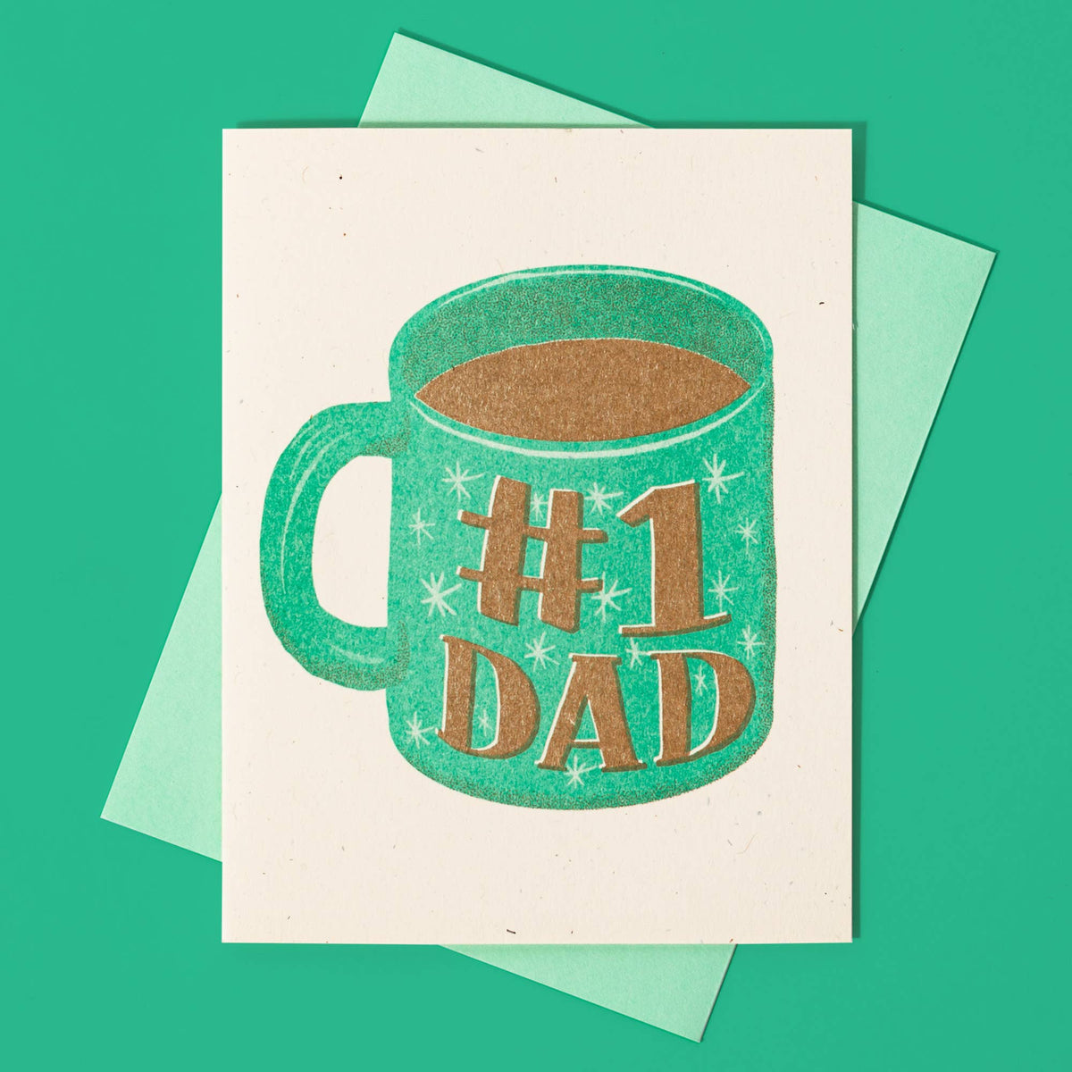 Handmade risograph card featuring a turquoise coffee mug with "#1 Dad" text, unique artisan Father's Day gift design. - #1 Dad Mug - Risograph Card