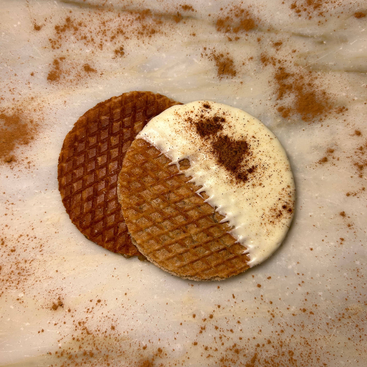 Two artisan pumpkin spice stroopwafels, one dipped in white chocolate with cinnamon dusting, handmade gift quality. - Pumpkin Spice Stroopwafels Gift Pack (6)