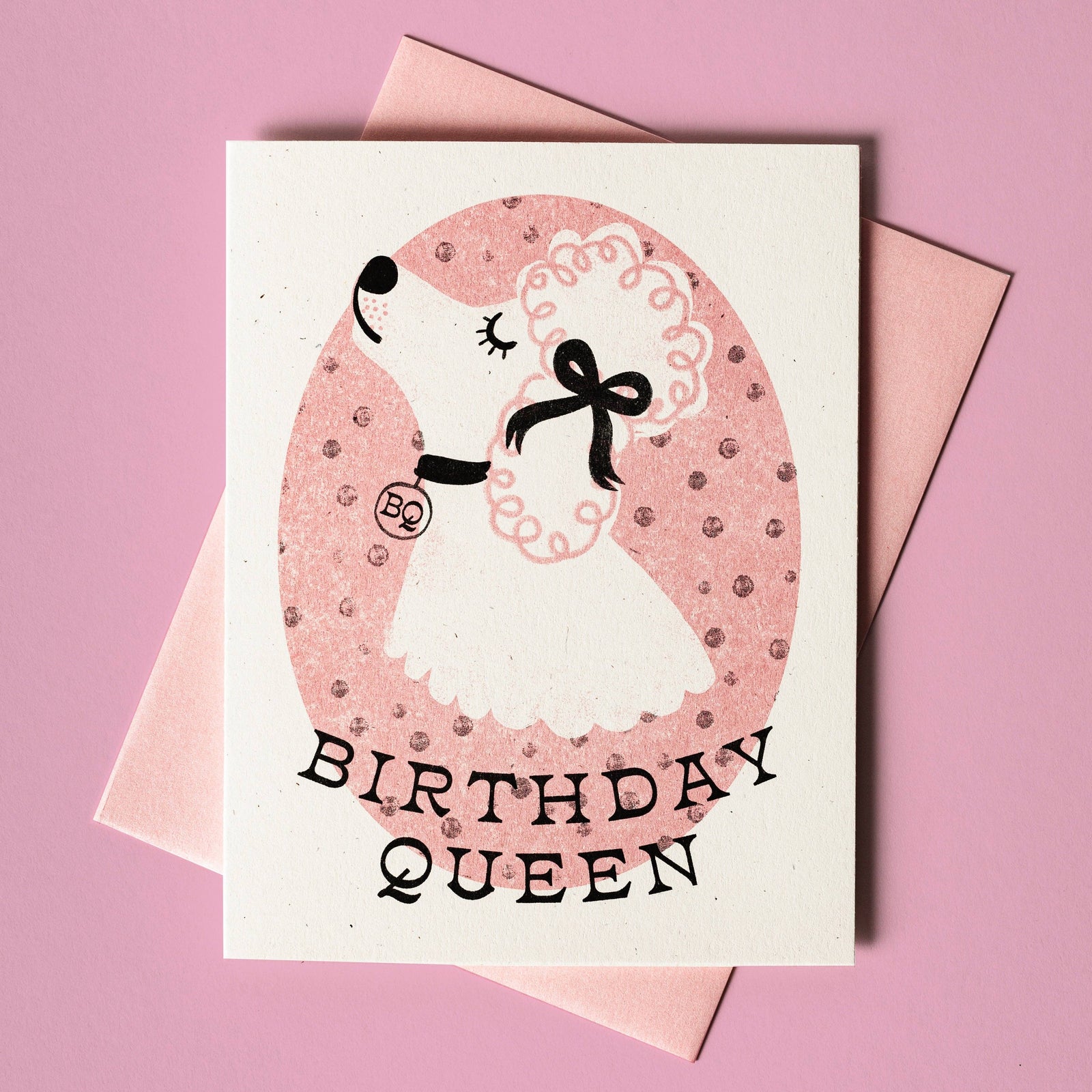 Handmade risograph card with a unique birthday queen dog illustration in pink and black, artisan gift design. - Birthday Queen Dog - Risograph Card