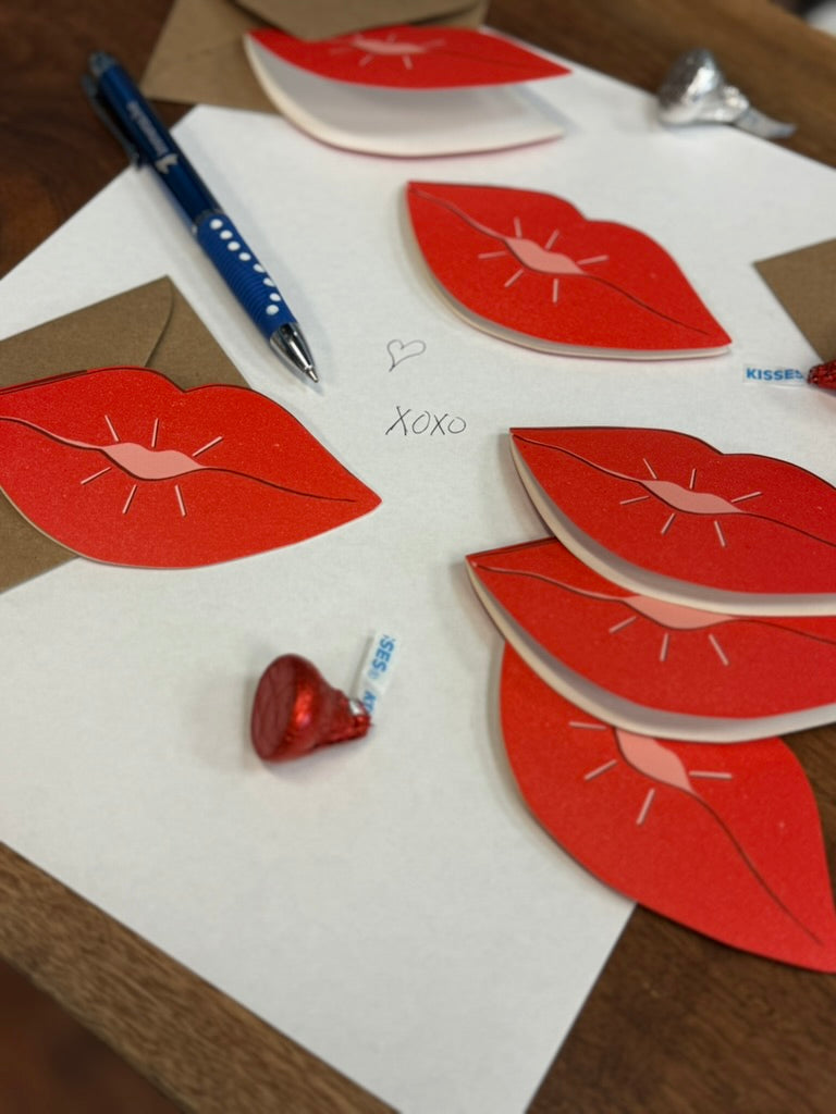 lip shaped valentine's day cards with pen, envelopes and chocolate kiss candy