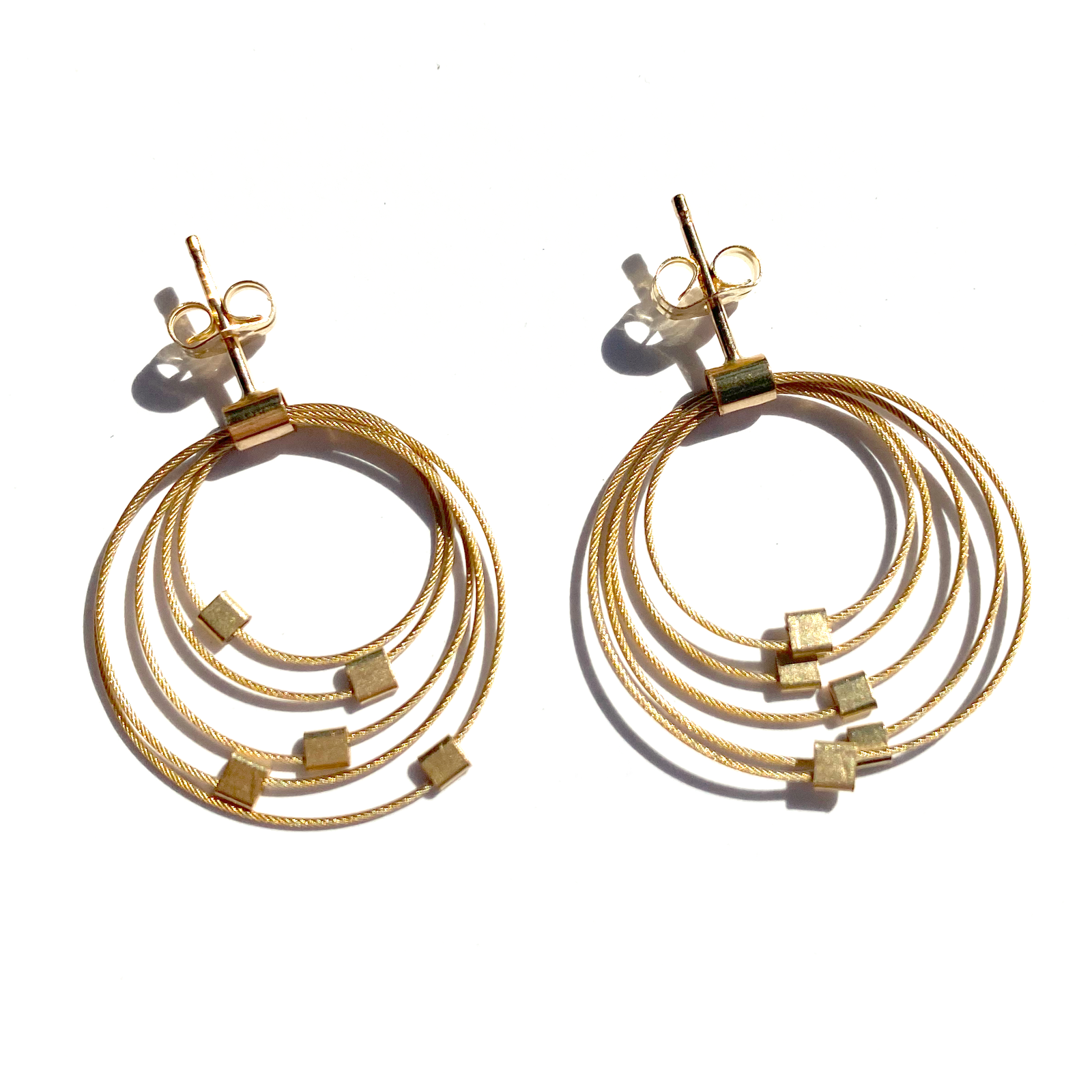 Handmade gold-tone ombre circle post earrings with layered hoop design and small square accents, unique artisan gift. - Ombre Circle Post Earrings