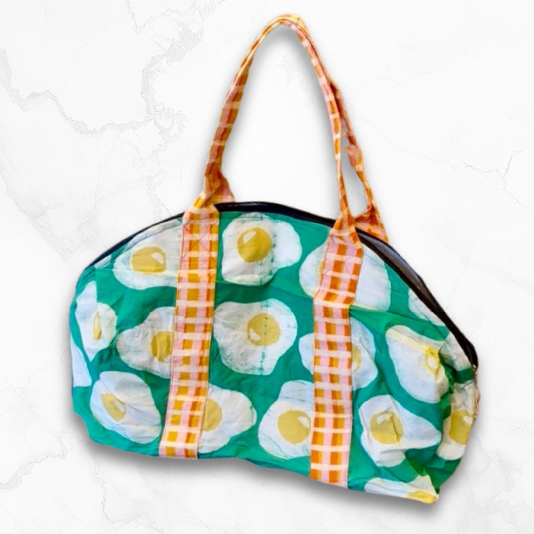 tote bag with egg pattern, green background and orange plaid handles