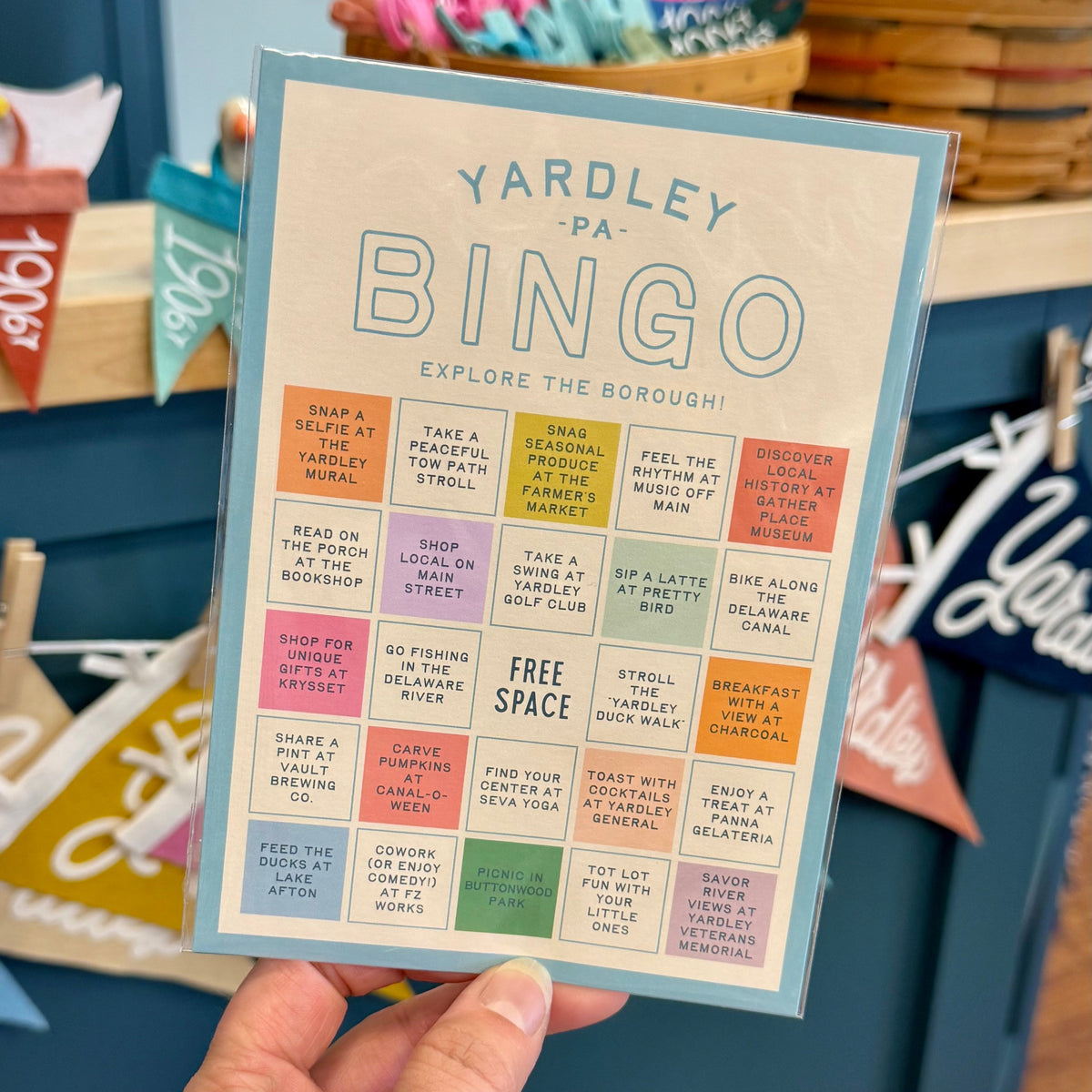 Yardley PA Bingo card held by a hand with a colorful background