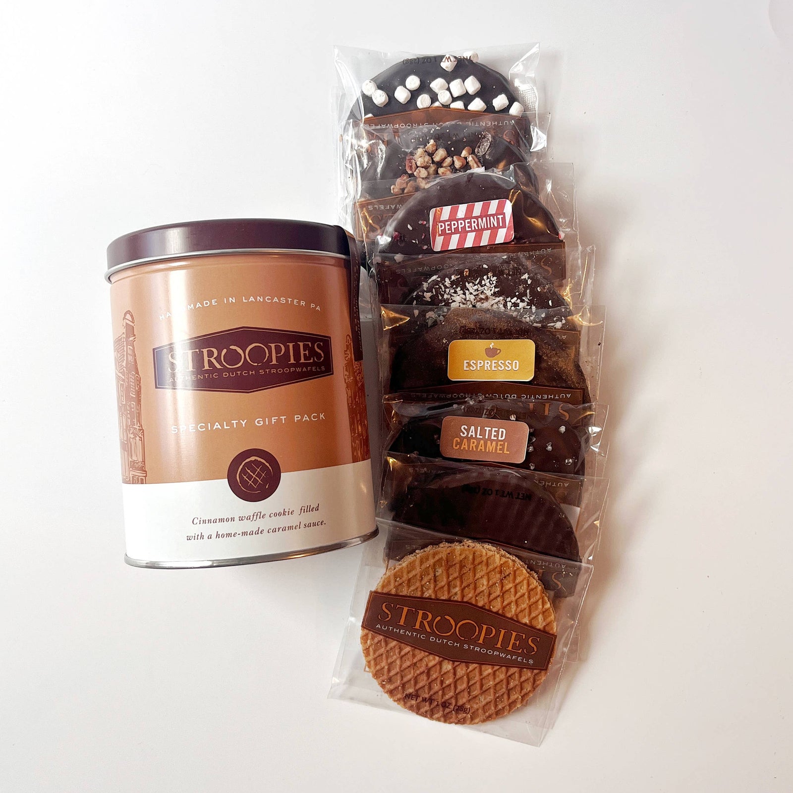 Stroopwafel tin of cookies in a container on a white background